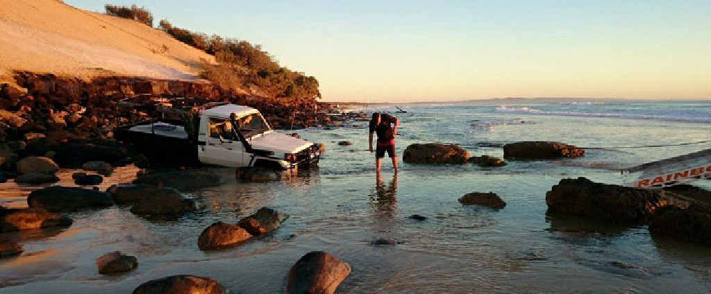 SWAMPED: Rainbow Beach Towing and Roadside Assist recover a Land Cruiser trapped on the Mudlo Rocks Sunday morning. SWAMPED: Rainbow Beach Towing and Roadside Assist recover a Land Cruiser trapped on the Mudlo Rocks Sunday morning.